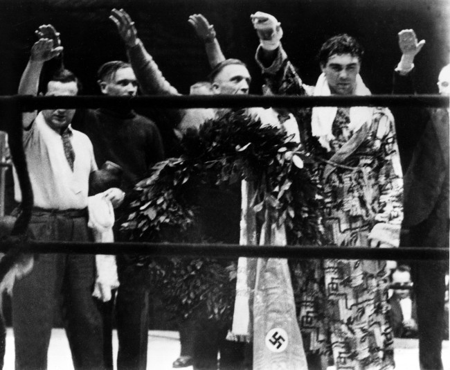 Max Schmeling 1931 World Heavyweight Champion - Max Schmeling, right, and his attendants give the Nazi salute in Hamburg, Germany, March 10, 1935. (Associated Press)
