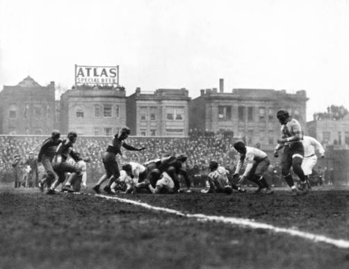Wrigley at 100: Chicago Bears - The Chicago Bears recover their quarterback's fumble and go on to win the first scheduled NFL Football Championship game over the New York Giants at Wrigley Field by a score of 23-21 on Dec. 17, 1933. (Chicago Tribune / Getty Images)