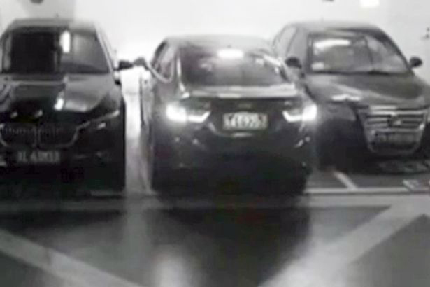 Hilarious footage shows the man clambering out of the boot of his car after squeezing into a tight spot in China
